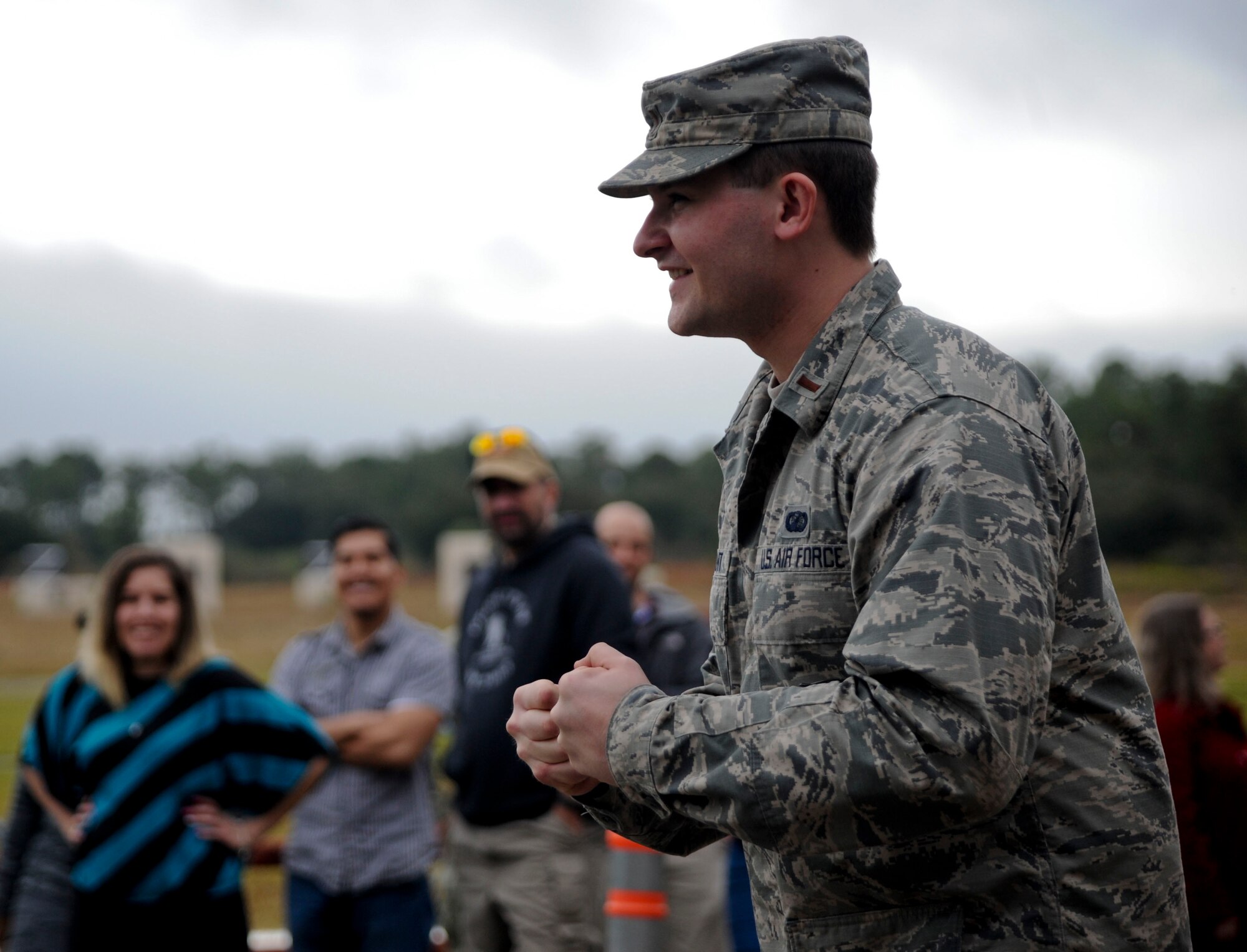 U.S. Air Force 2nd Lt. Nicholas Quartemont, a directed energy applications physicist assigned to the Air Force Research Laboratory, reacts to a momentary beam from the Active Denial System during a demonstration at MacDill Air Force Base, Fla., Jan. 27, 2016. The beam produces an intolerable heat sensation, compelling the targeted individual to instinctively move out of its range. (U.S. Air Force photo by Senior Airman Danielle Quilla)