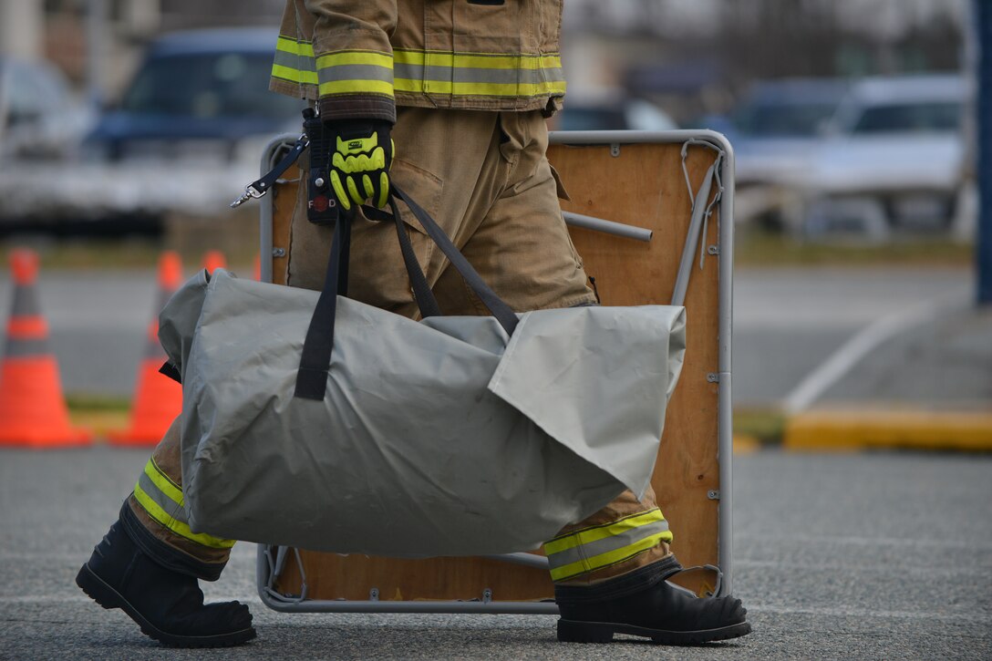 Firefighters prepare to build a decontamination station during a joint chemical, biological, radiological, nuclear and high-yield explosive threat exercise at Fort Eustis, Va., Jan. 28, 2016. The exercise tested Langley Air Force Base and Fort Eustis first responders on their ability to communicate with one another while eliminating the CBRNE threat. (U.S. Air Force photo by Staff Sgt. Natasha Stannard)