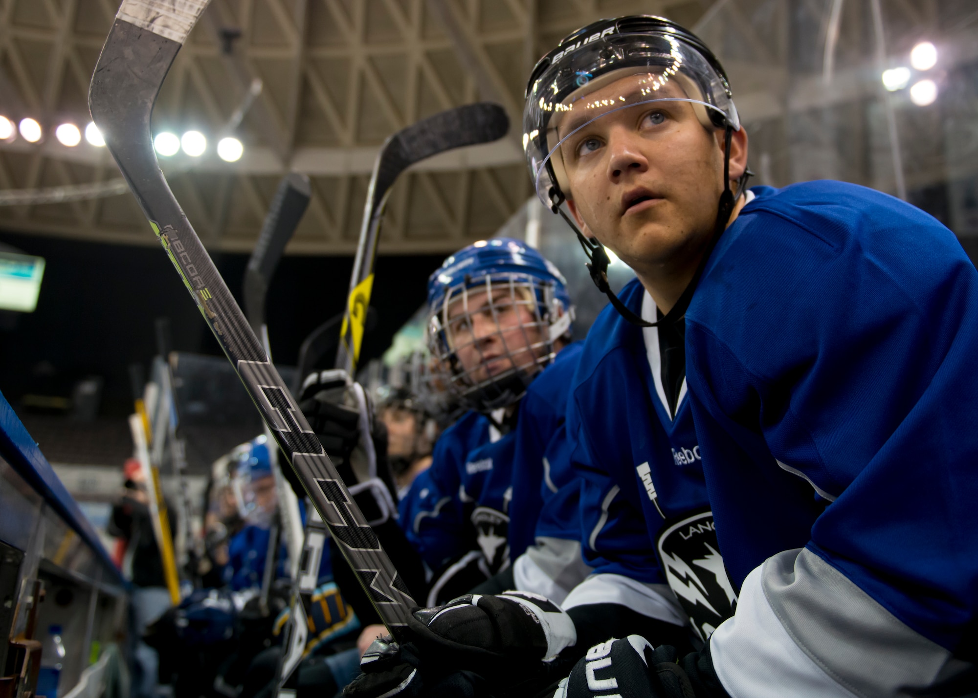 Members of the Langley Air Force Base Men’s Varsity Hockey team, the Langley Raptors, rest after a line change during the “Air versus Sea” hockey game at the Norfolk Scope Arena in Norfolk, Va., Jan. 30, 2016. The Raptors scored in the first 30 seconds and never relinquished the lead throughout the game.(U.S. Air Force photo by Staff Sgt. J.D. Strong II)