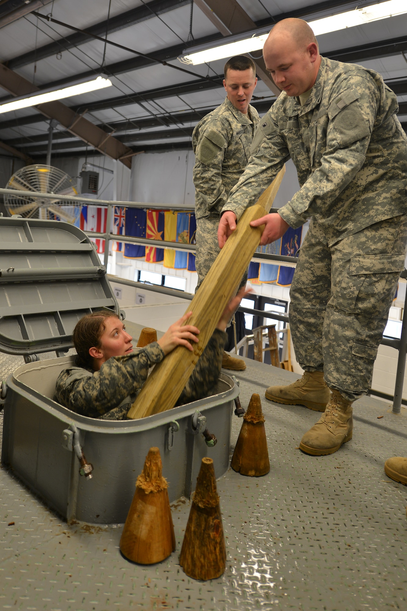 U.S. Army Maritime Intermodal Training Department watercraft operator students gather supplies for damage control tank training at Fort Eustis, Va., Jan. 26, 2016. The damage control tank is a ship taking-on-water simulation exercise that tests the students’ ability to stop more water from rushing into a vessel. (U.S. Air Force photo by Staff Sgt. Natasha Stannard)