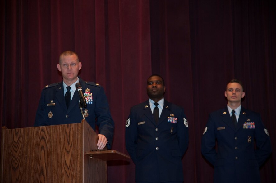 Lt. Col. Dustin Sutton, 5th Security Forces Squadron commander, speaks during Military Working Dog Kitty’s memorial service at Minot Air Force Base, N.D., Feb. 2, 2016. Kitty had been retired for a month when she died of an illness. (U.S. Air Force photo/Airman 1st Class Christian Sullivan)