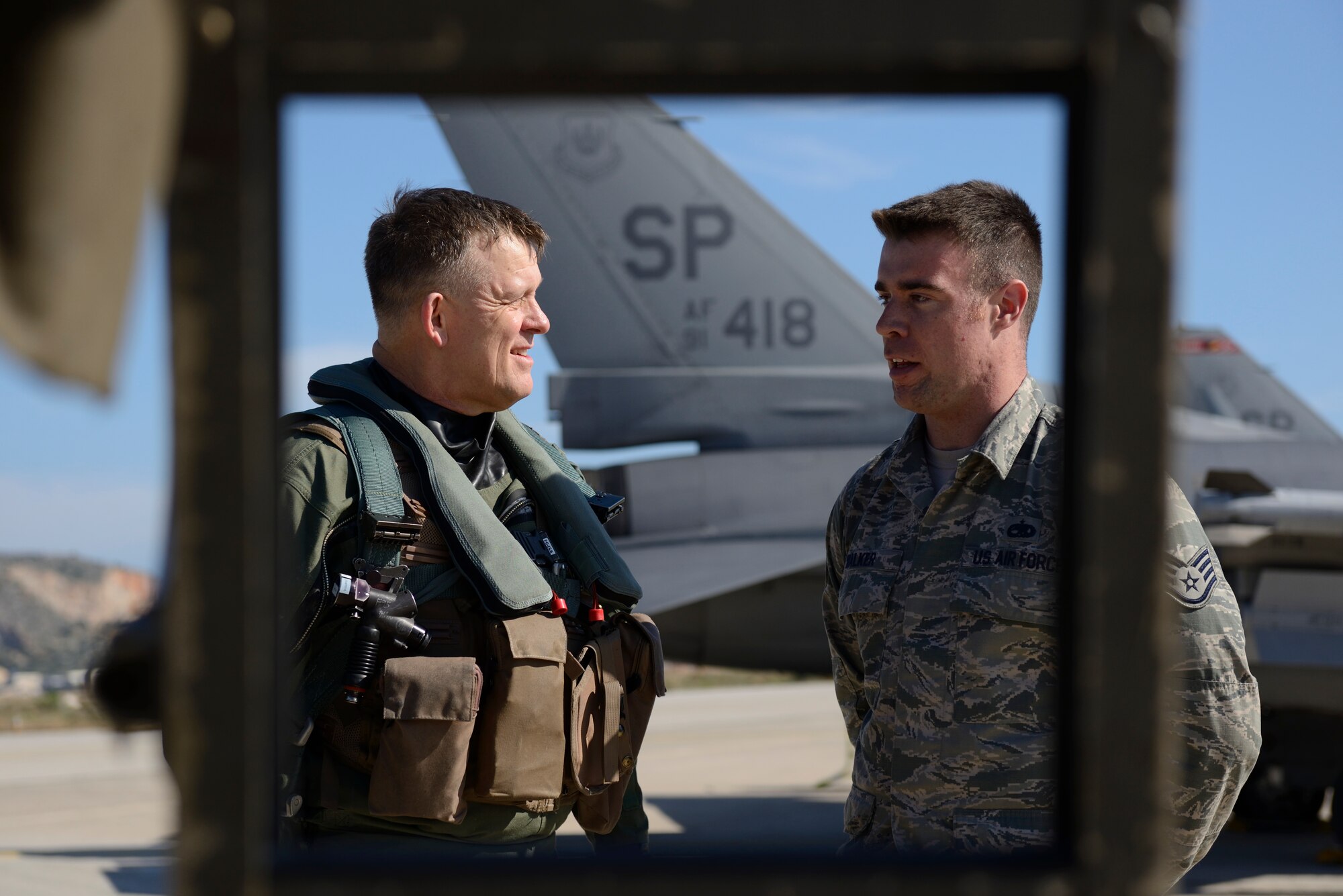 U.S. Air Forces in Europe and Air Forces Africa commander Gen. Frank Gorenc speaks with U.S. Air Force Staff Sgt. Daniel Walker, a crew chief assigned to the 480th Expeditionary Fighter Squadron, before departure during a flying training deployment at Souda Bay, Greece, Feb. 1. 2016.  Gorenc and Walker talked about how the FTD was progressing in its second week. (U.S. Air Force photo by Staff Sgt. Christopher Ruano/Released)