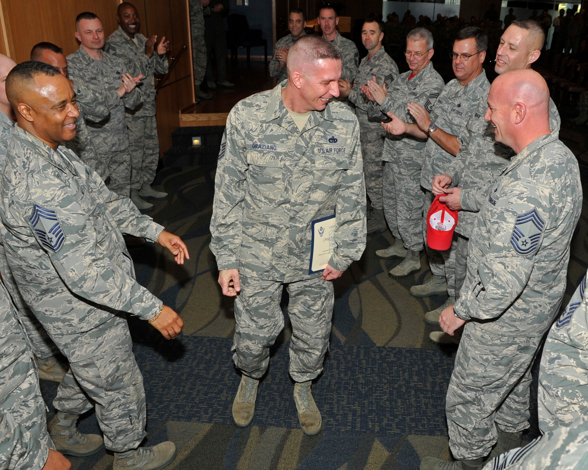 Newly promoted Chief Master Sgt. Frank Graziano, 325th Logistics Readiness Squadron superintendent, is congratulated by other chiefs at Tyndall Air Force Base, Fla., Jan. 29 2016, at Tyndall’s Horizon Community Center after a base promotion ceremony. These ceremonies are held to acknowledge those receiving a new rank. (U.S. Air Force photo by Senior Airman Sergio A. Gamboa/Released)