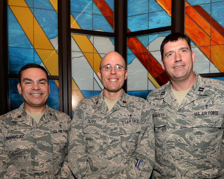 (From left to right) Major Ismael Rodriguez, Capt. Brett Hedgepeth, and Maj. Rudy Olivo, 325th Fighter Wing chaplains, pose for a photo Feb. 3 at the Base Chapel.  The Chaplain Corps provides spiritual care and is in place to protect and defend all Airmen and their family's constitutional right to free exercise of religion. This is accomplished by providing opportunities for religious worship and observances and advising leadership on spiritual, ethical, moral, morale and religious accommodation issues. (U.S. Air Force photo by Senior Airman Solomon Cook/Released)