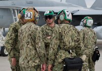 United States Navy Airman Ryan Smith, VAQ-138 plane captain from Naval Air Station Whidbey Island, Wash., marshals in an EA-18G Growler during Red Flag 16-1, Jan. 29, 2016 at Nellis AFB, Nev. Red Flag brings together units from all over the world including multiple military branches and countries. One thing they all have in common is the need for experienced maintainers. (U.S. Air Force photo by Senior Airman Alex Fox Echols III/Released)