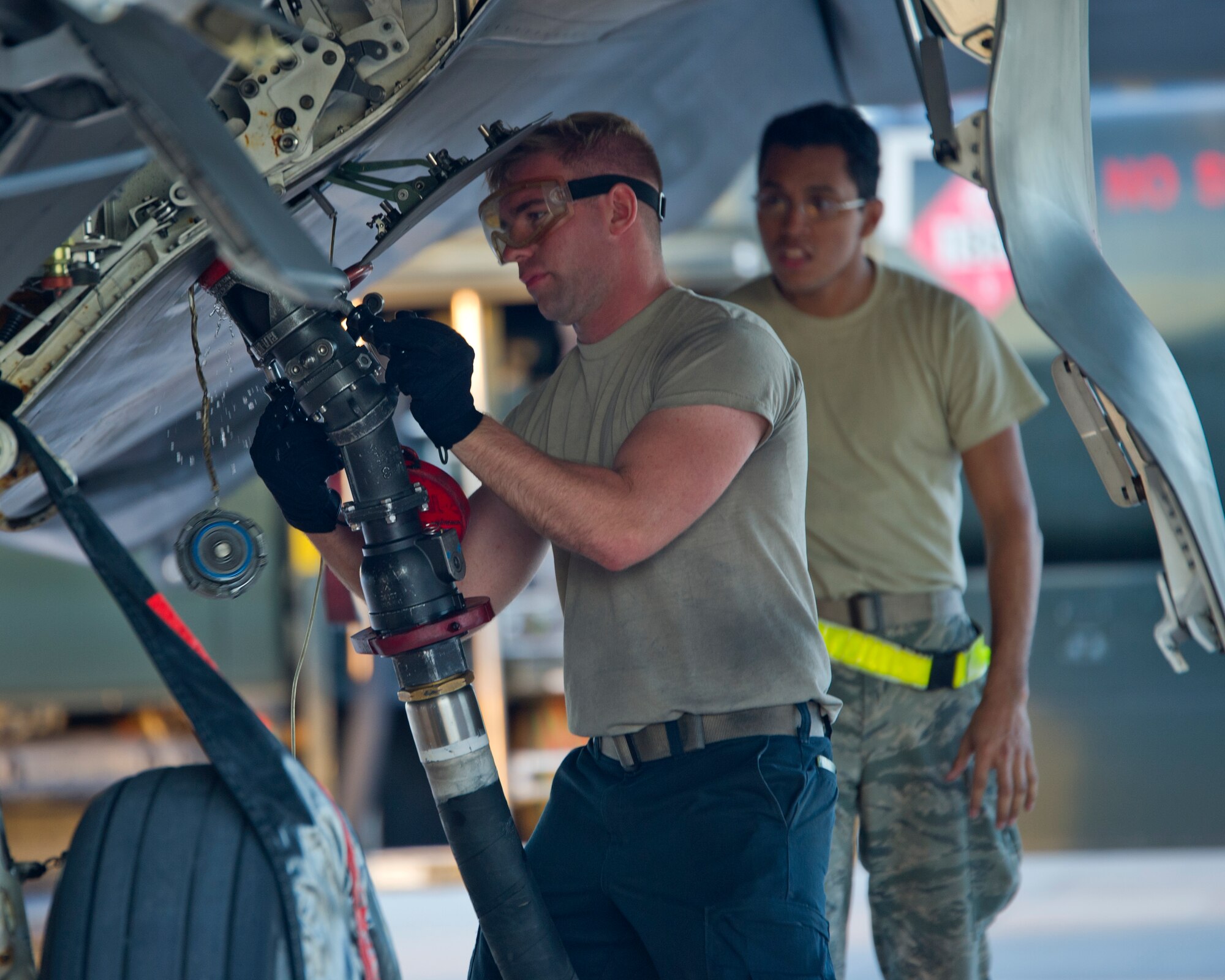 Airman 1st Class Nickalos Barentine, 95th Aircraft Maintenance Unit crew chief, Tyndall AFB, Fla., and Airman 1st Class Alexis Aragon, 7th Logistics Readiness Squadron fuels specialist, Dyess AFB, Texas, refuel an F-22 Raptor during Red Flag 16-1, Jan. 28, 2016 at Nellis AFB, Nev. “Fuels is the lifeline of every aircraft, and without fuel these aircraft can’t go anywhere,” said Aragon. “I love it because I know we’re helping get the mission done.” (U.S. Air Force photo by Senior Airman Alex Fox Echols III/Released)