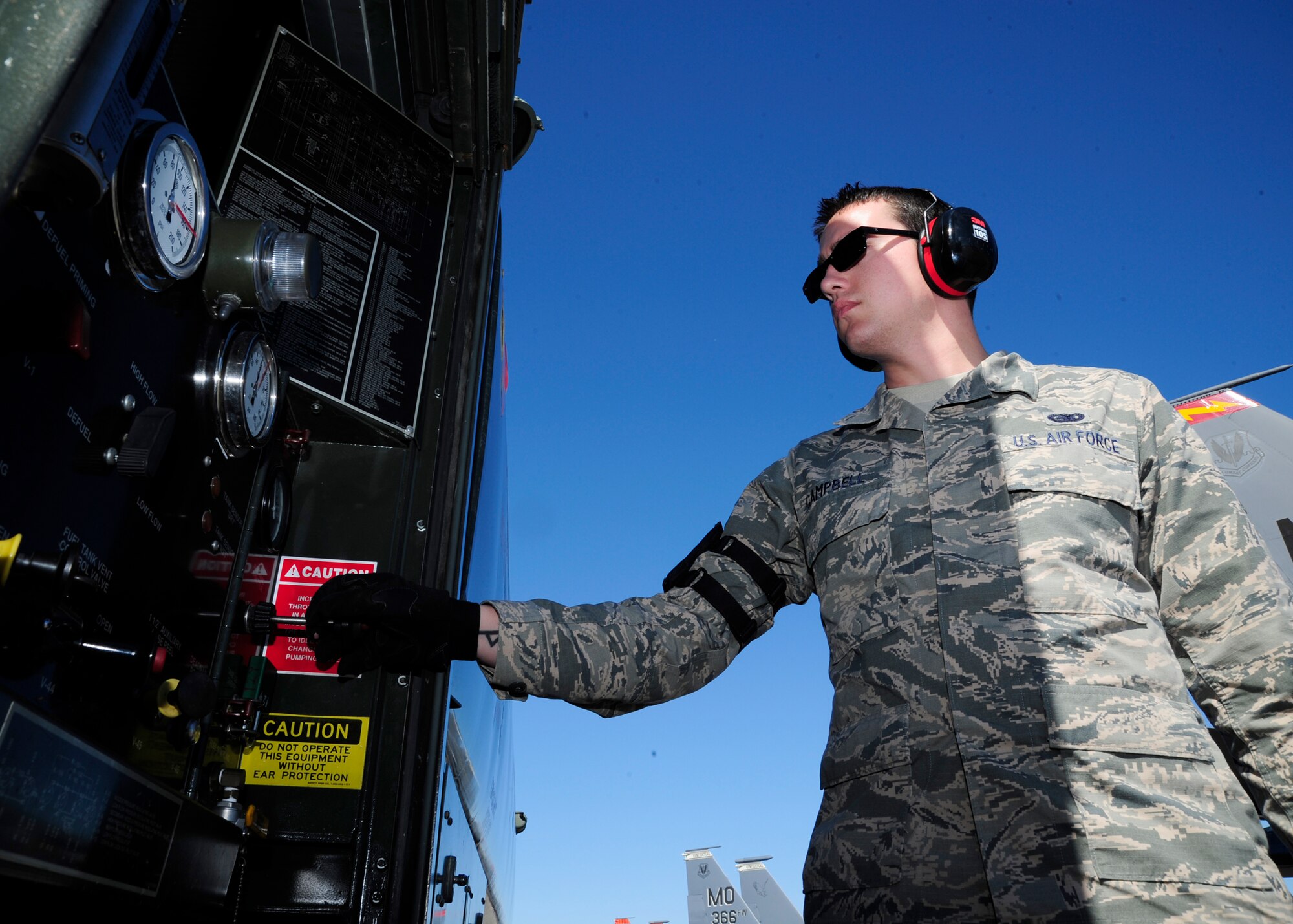 Senior Airman Shawn Campbell, 325th Logistics Readiness Squadron fuels specialist, prepares an R-11 refueler, Jan. 28, before refilling an aircraft on the flightline. The Fuels Management Flight provides superior fuel support to the 325th Fighter Wing. Men and women from this section provide petroleum products to more than 50 assigned aircraft, 641 wing vehicles and 100 organizational tanks and generators. (U.S. Air Force photo by Senior Airman Solomon Cook/ Released)