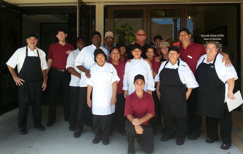 The Riverside Dining Facility staff stands in front of the dining facility with Chef Robert Irvine during his visit to Patrick Air Force Base, Fla., July 23, 2015. The Best Never Rest is the 45th Force Support Squadron's motto, and the team is eager to showcase the RDF during the Air Force Hennessy evaluation, which begins Feb. 11, 2016. (Courtesy photo) 
