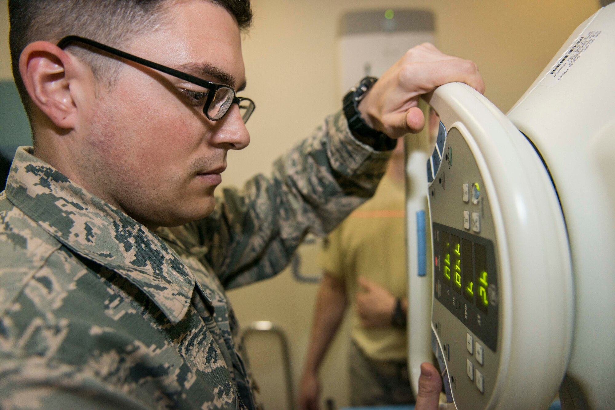 U.S. Air Force Airman 1st Class Jason Grosso, a diagnostic imaging technologist with the 35th Surgical Operations Squadron, captures a “Y-view” image of a patient’s shoulder using a semi-digital x-ray machine that turns radiation into light at Misawa Air Base, Japan, Jan. 27, 2016. The Y-view is a lateral standard x-ray of the shoulder joint and is typically used to diagnose and treat dislocations. This x-ray machine is a safer version of its predecessors, reducing the amount of radiation needed to produce a diagnostic image. Grosso hails from Bridgman, Michigan. (U.S. Air Force photo by Staff Sgt. Benjamin W. Stratton)