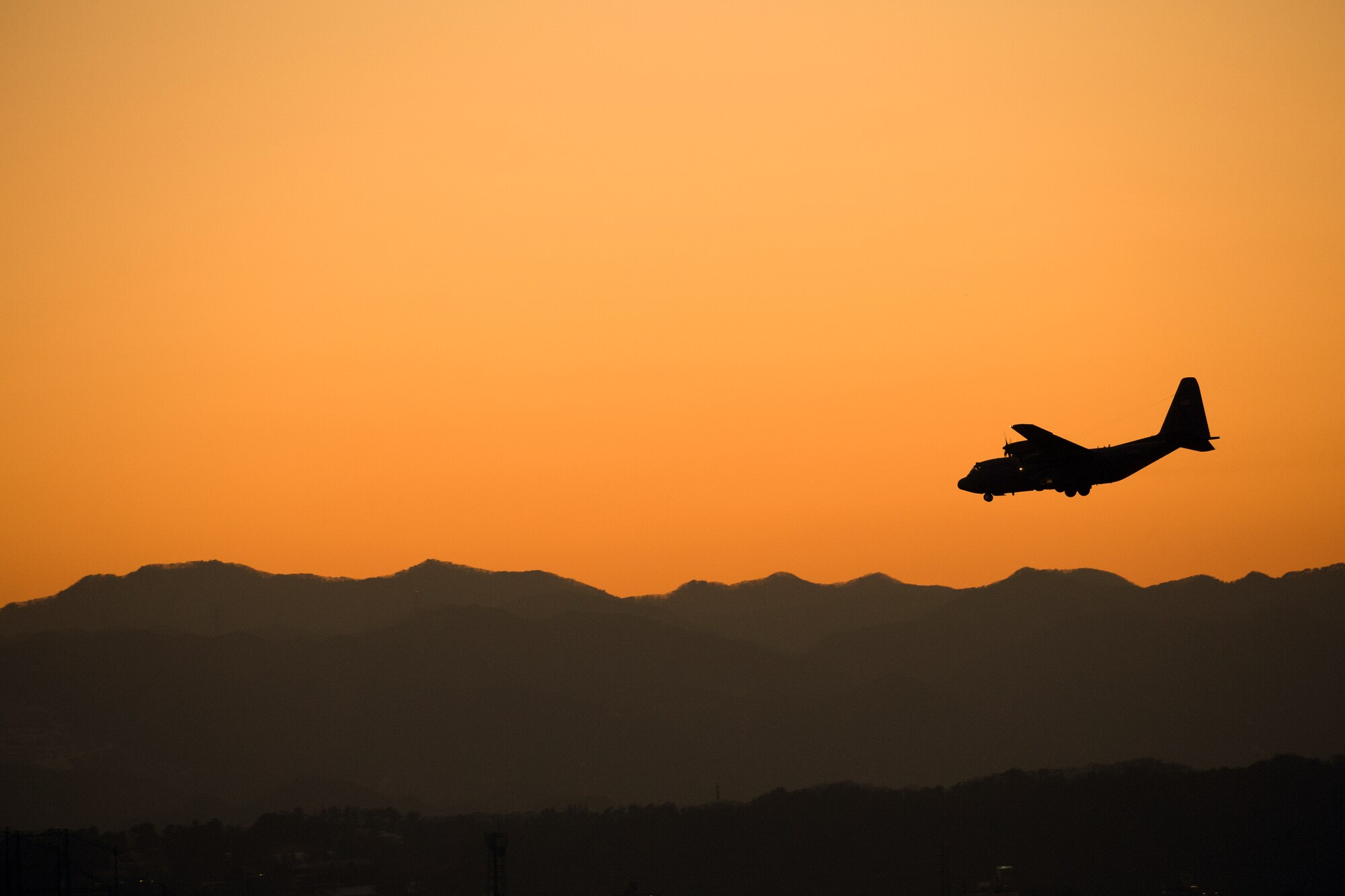 A C-130 Hercules assigned to the 36th Airlift Squadron is ready to land at Yokota Air Base, Japan, Jan. 26, 2016, during a routine sortie. The 36 AS regularly conducts training missions to remain proficient in the necessary skills to support any contingency. (U.S. Air Force photo by Osakabe Yasuo/Released)