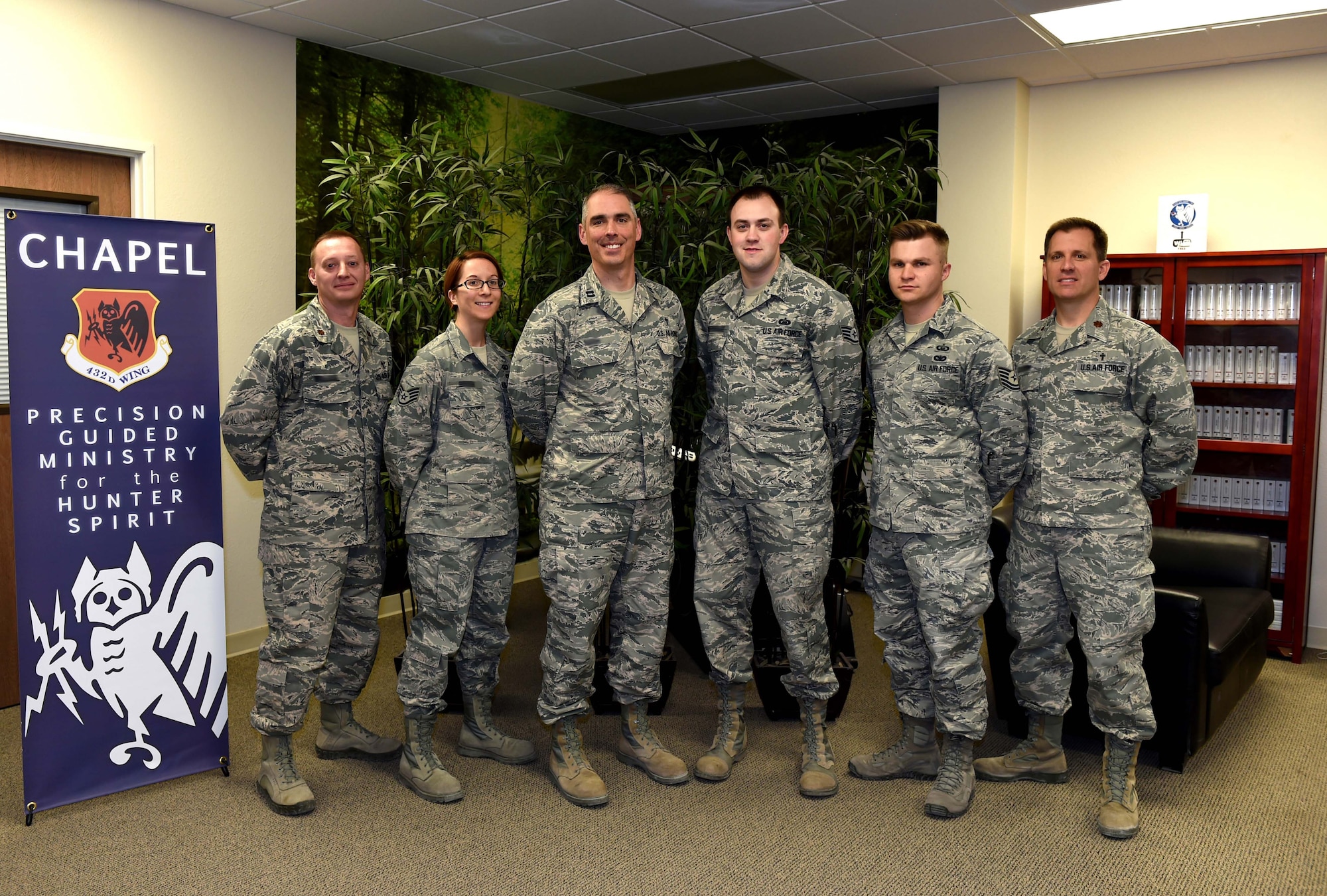 The Chaplain Corps at Creech Air Force Base, Nevada, poses for a photo Jan. 20, 2016, at the Creech Airman Ministry Center.  The team is dedicated to taking care of the Hunter family by bringing precision guided ministry to the mission. Through unit visitation and meeting with Airmen for spiritual and religious counseling, Chaplains contribute to the success of the mission. (U.S. Air Force photo by Airman 1st Class Kristan Campbell/Released)