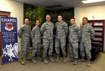 The Chaplain Corps at Creech Air Force Base, Nevada, poses for a photo Jan. 20, 2016, at the Creech Airman Ministry Center.  The team is dedicated to taking care of the Hunter family by bringing precision guided ministry to the mission. Through unit visitation and meeting with Airmen for spiritual and religious counseling, Chaplains contribute to the success of the mission. (U.S. Air Force photo by Airman 1st Class Kristan Campbell/Released)