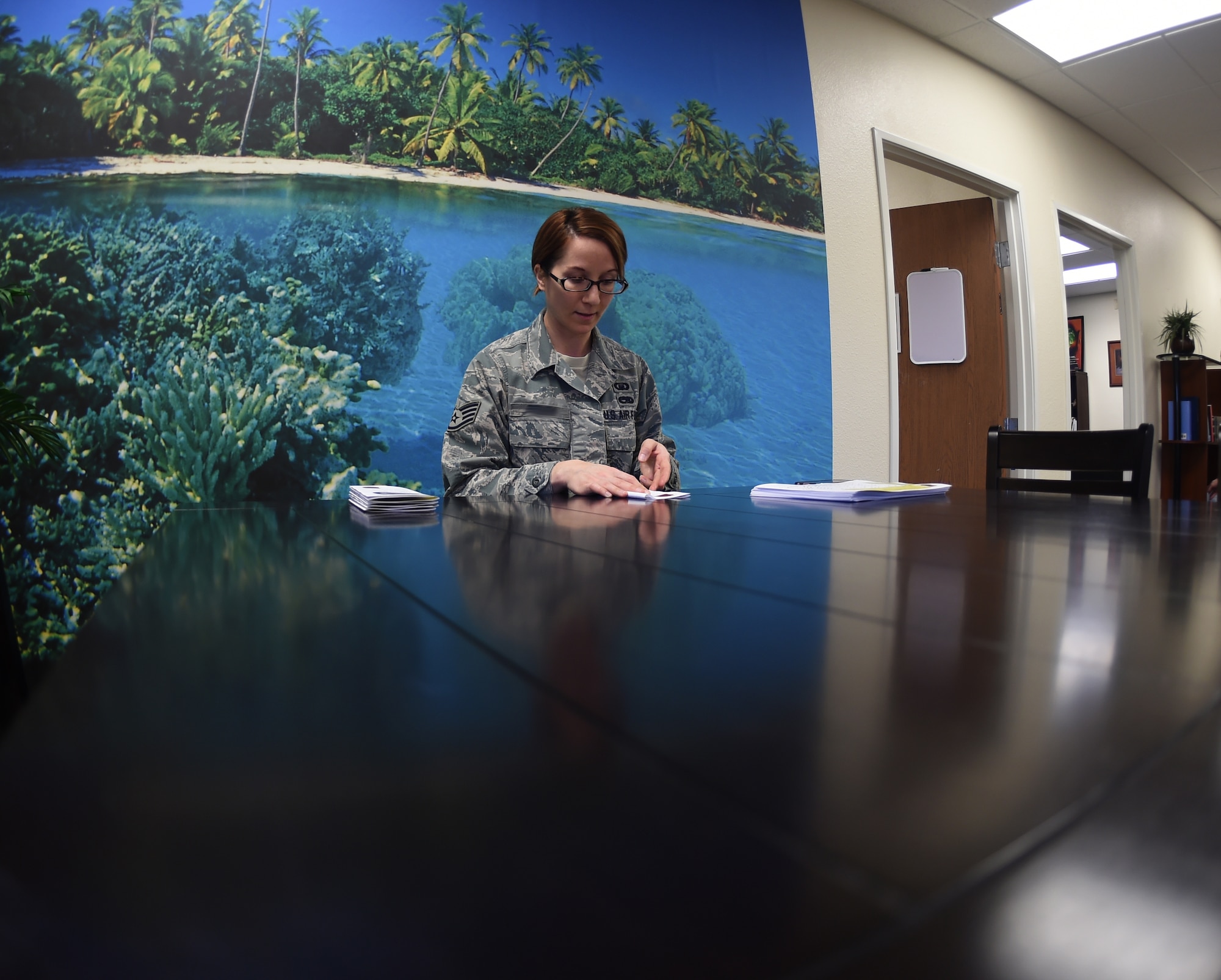 Staff Sgt. Sarah, 452nd Air Mobility Wing chaplain assistant, prepares for a meeting with the chaplain corps Jan. 20, 2016, at Creech Air Force Base, Nevada. Sarah and Chaplain (Maj.) Cameron, 47th Flying Training Wing Individual Mobilization Augmentee, are new additions to the Creech team. Adding to the manning at the Airman Ministry Center has increased chaplain availability for Airmen seeking spiritual and religious guidance. (U.S. Air Force Photo by Airman 1st Class Kristan Campbell/ released)