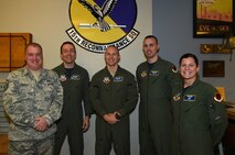 Tech. Sgt. Leonel, 15th Reconnaissance Squadron instructor sensor operator, center, poses with his leadership for a photo Jan. 29, 2015, at Creech Air Force Base, Nevada. Leonel was promoted under the Stripes for Exceptional Performers program as a testimony to his character as an Airman. (U.S. Air Force Photo by Airman 1st Class Kristan Campbell/Released)