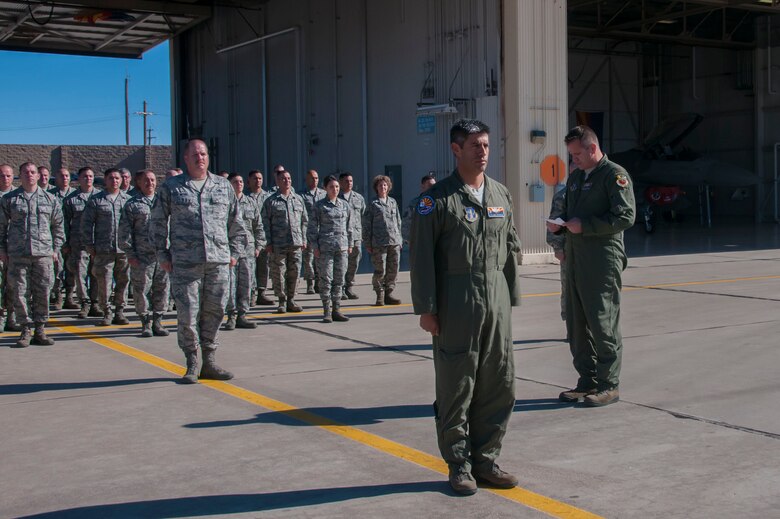 Maj. Douglas Charters director of operations of the Arizona Air National Guard’s 162nd Wing Aerospace Control Alert detachment located at Davis-Monthan Air Force Base reads the Air Force Outstanding Unit Award citation during a presentation ceremony.  The AFOUA was given to the ACA for outstanding performance during the period of Nov. 1, 2012 through Oct. 31, 2014. (U.S. Air National Guard photo by 2d Lt. Lacey Roberts)