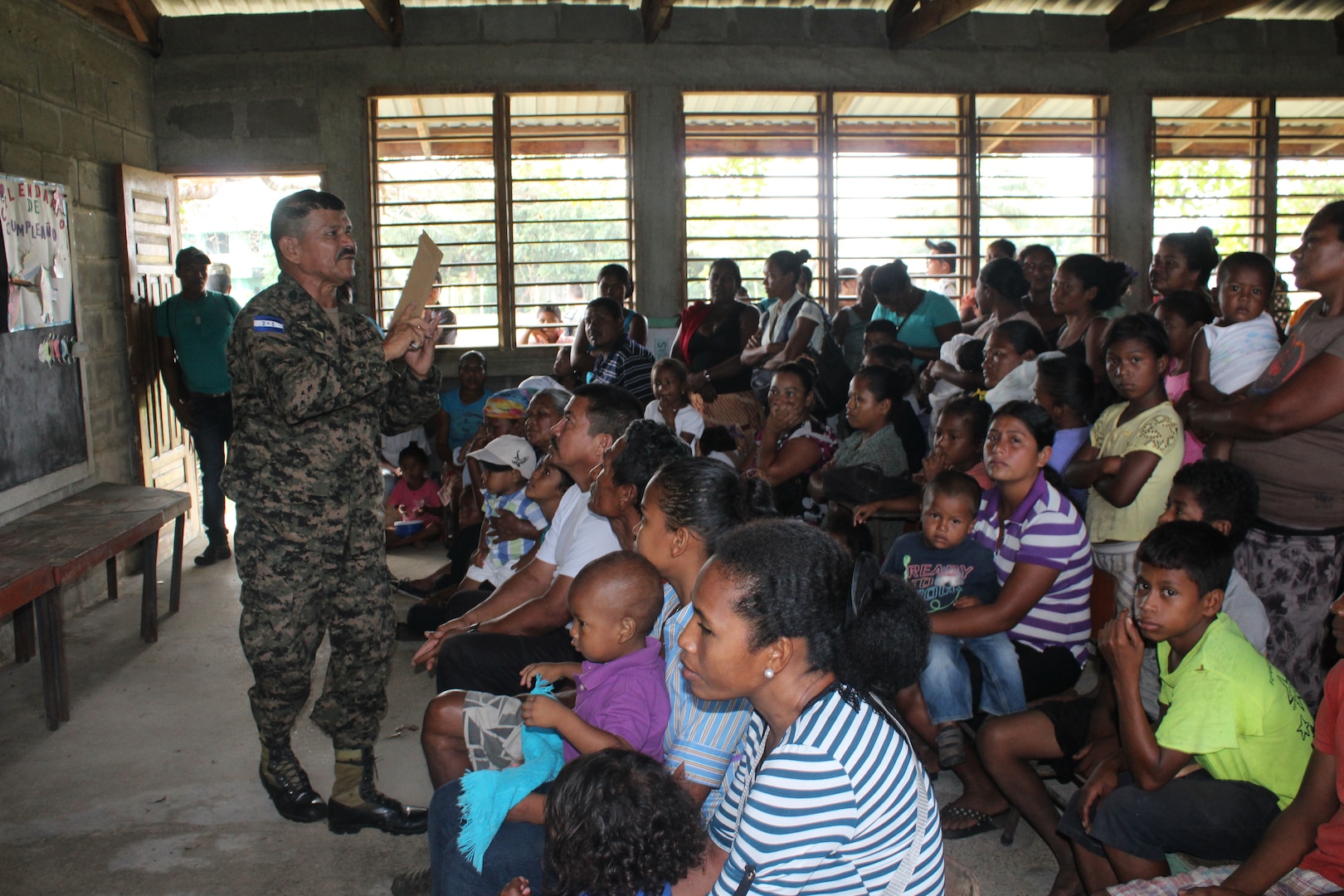 Sgt. Luis Alons211099o Aleman, with the Honduran Army  6th Infantry Battalion, gives patients a preventive health class before visiting the medical care providers during a Medical Readiness Training Exercise in Nueva Jerusalén, Gracias a Dios Department, Honduras, Jan. 28, 2016. This class is intended to help prevent many of the common illnesses in the area, which can be prevented through basic hygiene measures. (U.S. Army photo by Maria Pinel/Released)