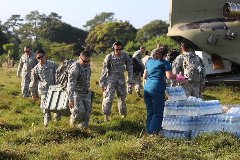 Service members from Joint Task Force-Bravo’s Medical Element unload medical supplies for a Medical Readiness Training Exercise in Nueva Jerusalén, Gracias a Dios Department, Honduras, Jan. 28, 2016. These partnerships allow service members to engage with the local community, while supporting local health organizations in remote areas of the host nation in need of medical services.   (U.S. Army photo by Maria Pinel/Released)