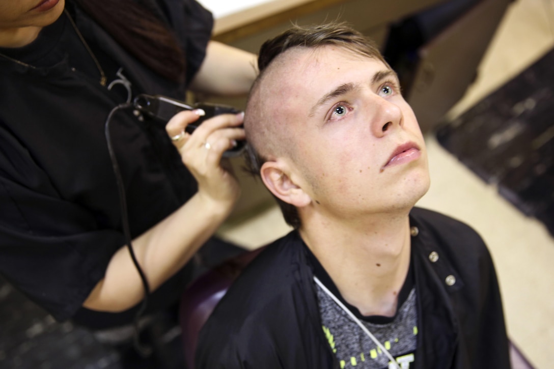 A Marine recruit gets his first haircut on Marine Corps Recruit Depot San Diego, Calif., Feb. 1, 2016. Recruits receive haircuts immediately upon arrival at the depot to foster uniformity. The recruit, assigned to Golf Company, 2nd Recruit Training Battalion, is scheduled to graduate April 29, 2016. Marine Corps photo by Sgt. Tyler Viglione