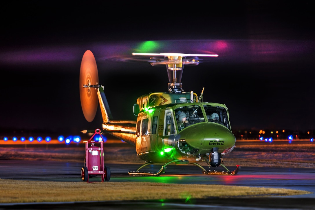 Air Force pilots start a UH-1N Iroquois helicopter on the helipad at Minot Air Force Base, N.D., Jan. 27, 2016. The pilots are assigned to the 54th Helicopter Squadron. Air Force photo by Airman 1st Class J.T. Armstrong
