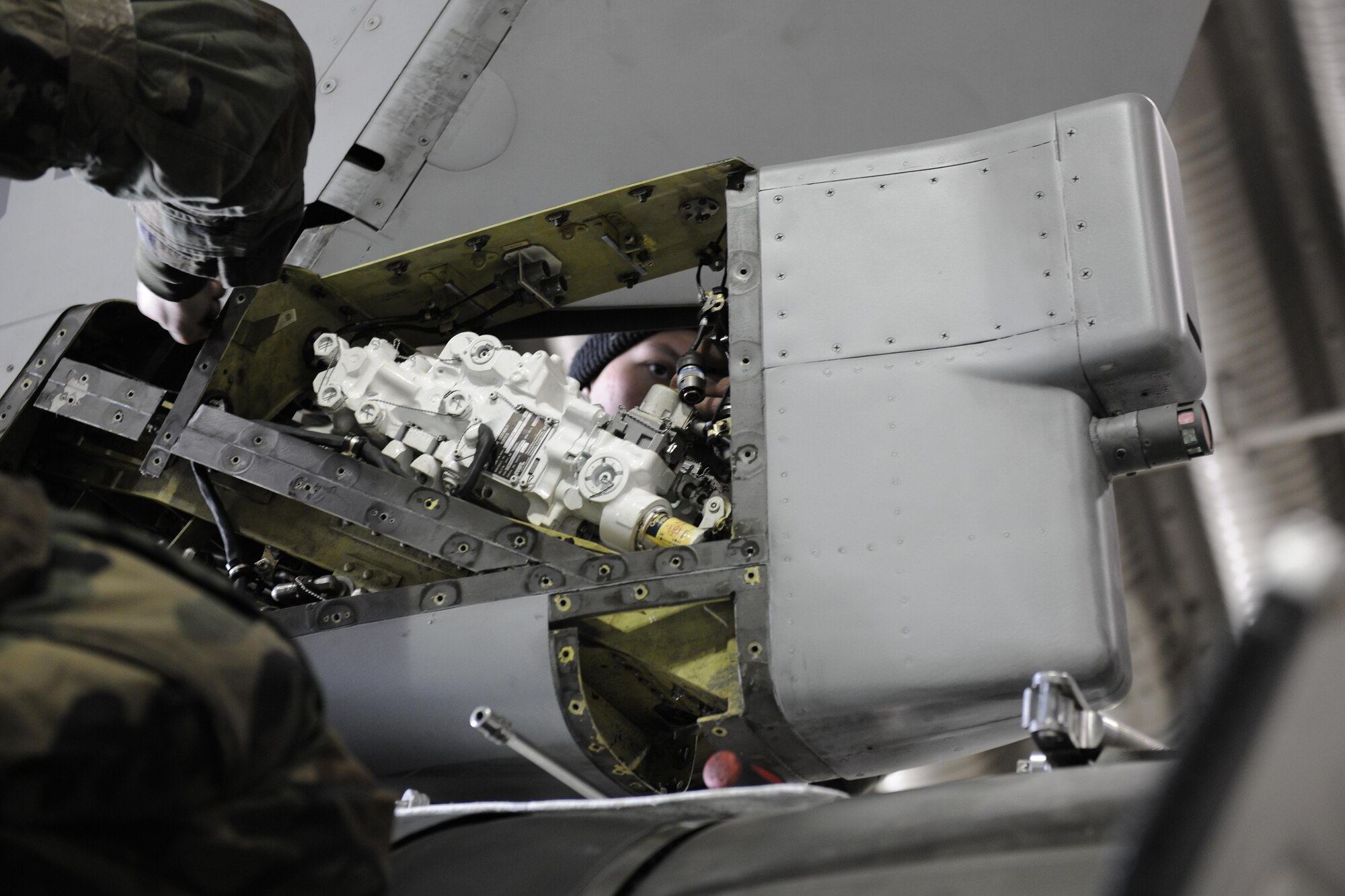 Senior Airman Brandon Brantmeier, 80th Aircraft Maintenance Squadron crew chief, works on removing a rudder servo actuator on an F-16 Fighting Falcon during Beverly Pack 16-2 at Kunsan Air Base, Republic of Korea, Feb. 3, 2015. (U.S. Air Force photo by Senior Airman Dustin King/Released) 