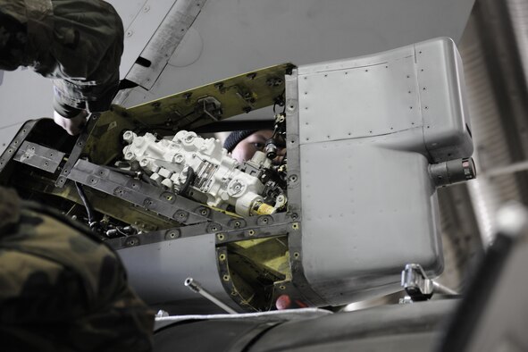 Senior Airman Brandon Brantmeier, 80th Aircraft Maintenance Squadron crew chief, works on removing a rudder servo actuator on an F-16 Fighting Falcon during Beverly Pack 16-2 at Kunsan Air Base, Republic of Korea, Feb. 3, 2015. (U.S. Air Force photo by Senior Airman Dustin King/Released) 