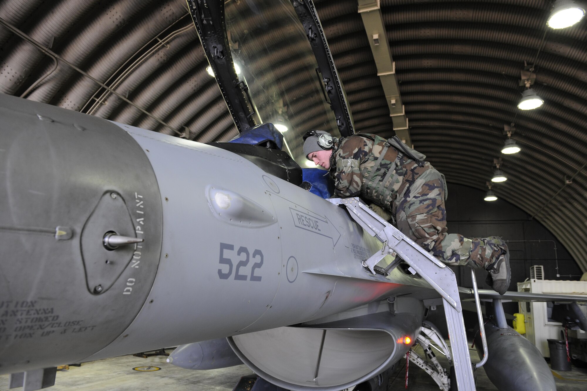 Senior Airman Kollin Bell, 35th Aircraft Maintenance Squadron crew chief, conducts a pre-flight lights inspection to ensure all critical lights are working on an F-16 Fighting Falcon during Beverly Pack 16-2 at Kunsan Air Base, Republic of Korea, Feb. 3, 2015. The 8th Maintenance Group’s over 1,000 Airmen have worked around-the-clock amid temperatures in the teens to ensure all the wing’s  F-16s are ready to fly safely. (U.S. Air Force photo by Senior Airman Dustin King/Released)