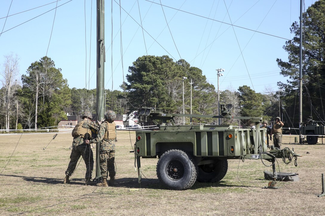 Marines with Headquarters Company, Combat Logistics Regiment 25, conduct a maintenance check on an antenna during a command post exercise at Camp Lejeune, N.C., Feb. 2, 2016. The CPX was held as a pre-cursor to an II Marine Expeditionary Force-wide CPX. (U.S. Marine Corps photo by Cpl. Paul S. Martinez/Released)