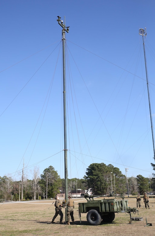 Marines with Headquarters Company, Combat Logistics Regiment 25, conduct a maintenance check on an antenna during a command post exercise at Camp Lejeune, N.C., Feb. 2, 2016. The mission of 2nd Marine Logistics Group is to provide general support combat logistics to all forces operating in the II Marine Expeditionary Force battlespace. (U.S. Marine Corps photo by Cpl. Paul S. Martinez/Released)