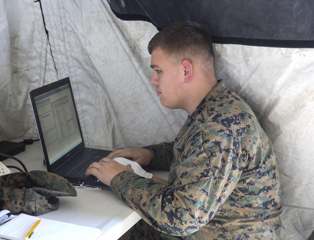Pfc. Alec Rivera, a cyber-network specialist with Headquarters Company, Combat Logistics Regiment 25, works on a computer during a command post exercise at Camp Lejeune, N.C., Feb. 2, 2016. As a cyber-network specialist, Rivera is responsible for configuring and maintaining connectivity across networks. (U.S. Marine Corps photo by Cpl. Paul S. Martinez/Released)