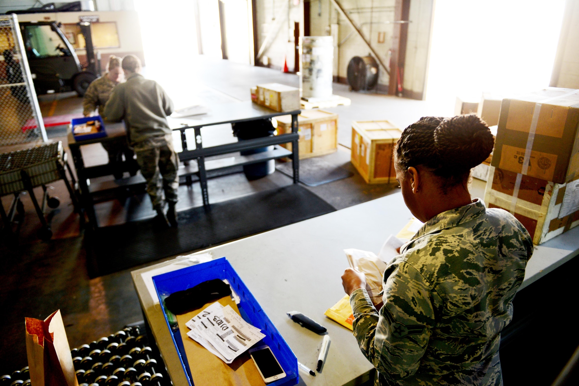 Airmen at 2nd Logistics Readiness Squadron traffic management receive and process packages at Barksdale Air Force Base, La., Jan. 29, 2016. Shipping and receiving Airmen process everything from personal mail to B-52 Stratofortress parts. (U.S. Air Force photo/Airman 1st Class Luke Hill)
