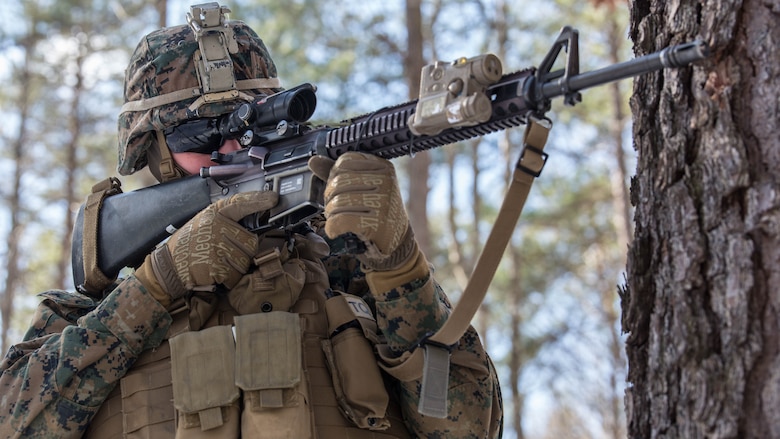 Private First Class Bradlee Hodson, a rifleman with 3rd Battalion, 2nd Marine Regiment, sights in while on patrol during a Deployment for Training exercise at Fort A.P. Hill., Va., Jan. 29, 2016. Although the temperature was below freezing, Marines still conducted multiple patrols to fine-tune their infantry tactics in unfamiliar terrain. The DFT is a requirement the unit completed for their upcoming deployment to Okinawa, Japan. 