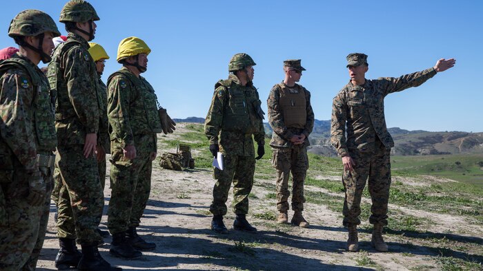 U.S. Marine Corps Staff Sgt. Justin Urbany (Right,) 81mm mortar section leader, 1st Battalion, 4th Marine Regiment, gives a range safety brief to Japan Ground Self-Defense Force Soldiers, prior to a live-fire mortar range, aboard Marine Corps Base Camp Pendleton, Calif., Feb. 1, 2016. This mortar range is a part of the second of four phases of training the soldiers of the JGSDF and USMC will be conducting during Exercise Iron Fist. This phase focuses on small unit skills and tactics before moving on to larger scale operations. 
