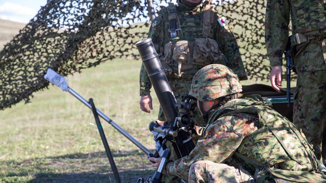 A Japan Ground Self-Defense Force mortarman sites in on a target during a live-fire exercise, aboard Marine Corps Base Camp Pendleton, Calif., Feb 1, 2016. U.S. Marines facilitated the use of the range acting as safety personnel, to allow the Japanese soldiers to hone fundamental skills and techniques they would be using throughout Exercise Iron Fist 2016.