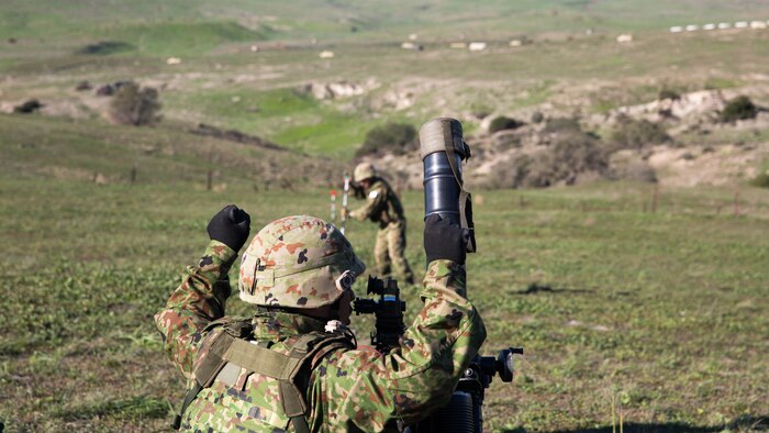 A Japan Ground Self-Defense Force mortar team adjusts their targeting stakes during a live-fire mortar range, during Exercise Iron Fist 2016, aboard Marine Corps Base Camp Pendleton, Calif., Feb 1, 2016. As a part of Exercise Iron Fist, this training was conducted to prepare the JGSDF soldiers for more advanced, bilateral combined arms training aboard Marine Corps Air-Ground Combat Center Twentynine Palms later in the month. 