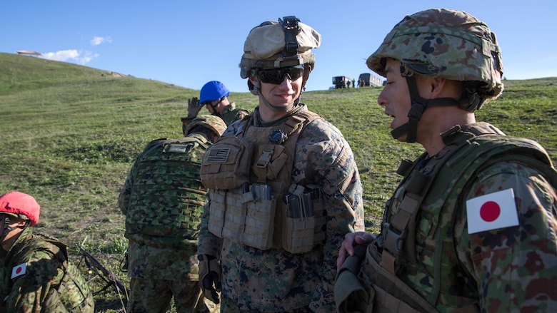 U.S. Marine Lance Cpl. Cody Bruyere, squad leader with Weapons Company, 1st Battalion, 4th Marine Regiment, discusses mortar skills and techniques with his Japan Ground Self-Defense Force counterpart during Exercise Iron Fist 2016 at Marine Corps Base Camp Pendleton, Calif., Feb 1, 2016 U.S. Marines facilitated the use of the range, acting as safety personnel to allow the Japanese soldiers the opportunity to hone the fundamental skills and techniques they will be using throughout the rest of Iron Fist. 