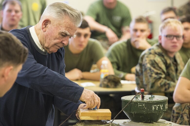 Vietnam veteran and retired Marine major, John Fasulo, instructs Marines with 3rd Battalion, 2nd Marine Regiment, about land mines during a Deployment for Training exercise at Fort A.P. Hill, Va., Jan. 29, 2016. Fasulo enjoys educating other Marines about explosives to ensure they are familiar with different weapon systems before they deploy. (U.S. Marine Corps photo by Lance Cpl. Samuel Guerra/Released)