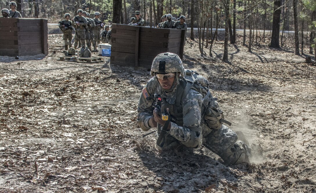 A Soldier in Basic Combat Training with C Company, 1st Battalion, 61st Infantry Regiment uses a three to five second rush to bound to the next overwatch position on the hand grenade assault course at Fort Jackson, S.C., Feb. 1, 2016. (U.S. Army photo by Sgt. 1st Class Brian Hamilton)