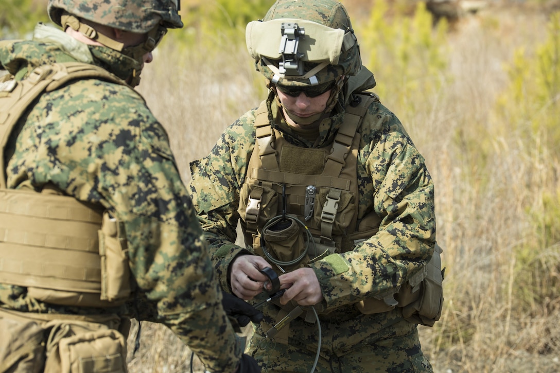 Private First Class Drax Stott, an assaultman with 3rd Battalion, 2nd Marine Regiment, prepares an improvised Bangalore torpedo for detonation during a Deployment for Training exercise at Fort A.P. Hill, Va., Jan. 28, 2016. Marines set off multiple charges throughout the day to sustain a high level of expertise with the explosives before deploying to Okinawa, Japan. (U.S. Marine Corps photo by Lance Cpl. Samuel Guerra/Released)