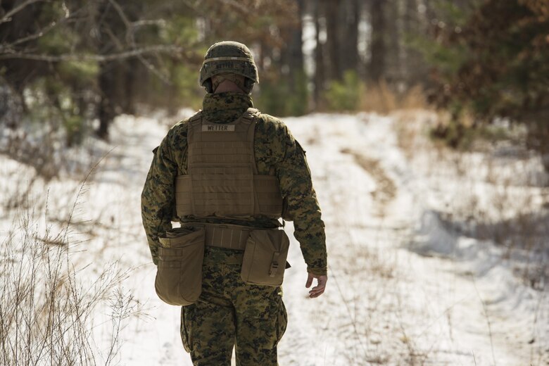 Staff Sgt. Kyle Wetter, a platoon sergeant 3rd Battalion, 2nd Marine Regiment, walks toward the improvised Bangalore impact zone during a Deployment for Training exercise at Fort A.P. Hill, Va., Jan. 28, 2016. Wetter was the range safety officer and had to ensure all equipment was removed before leaving the range. The exercise gave the battalion scenarios to strengthen their battle tactics and unit cohesion before they deploy to Okinawa, Japan. (U.S. Marine Corps photo by Lance Cpl. Samuel Guerra/ Released)