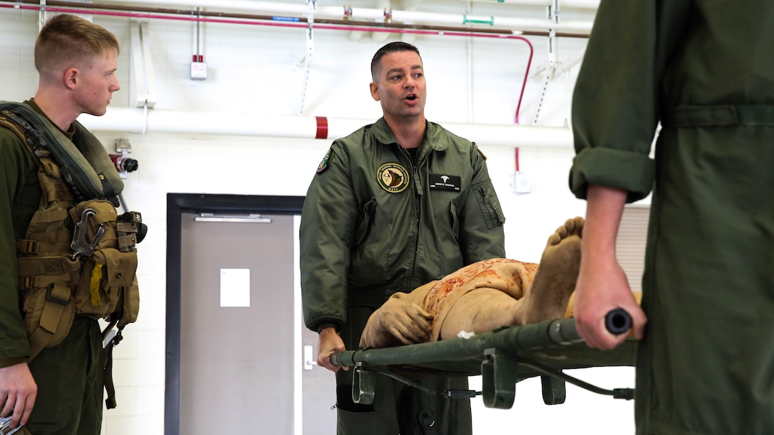 Petty Officer 2nd Class Mark Skaggs teaches Marines how to properly lift and carry casualties during a simulated causality evacuation scenario at Marine Corps Base Camp Pendleton, California, Jan. 27 2016. This training was part of the newly formed combat operation medical emergency transport training. COMETT exposes the aircrew to medical emergencies and procedures they may encounter in combat and non-combat environments. Skaggs, a Pensacola native, is an aeromedical safety corpsman with Marine Aircraft Group 29. 