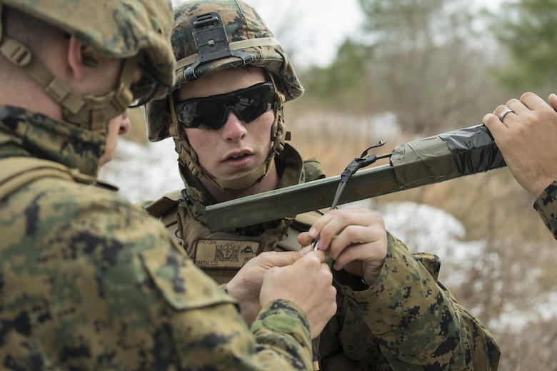 Lance Cpl. Colin Smith, a combat engineer with 2nd Combat Engineer Battalion, replaces blasting caps on an improvised Bangalore during a Deployment for Training exercise at Fort A.P. Hill, Va., Jan. 28, 2016. Marines utilized the larger ranges Fort A.P. Hill offers to gain a more realistic combat training experience before deploying to Okinawa, Japan. (U.S. Marine Corps photo by Lance Cpl. Samuel Guerra/ Released)