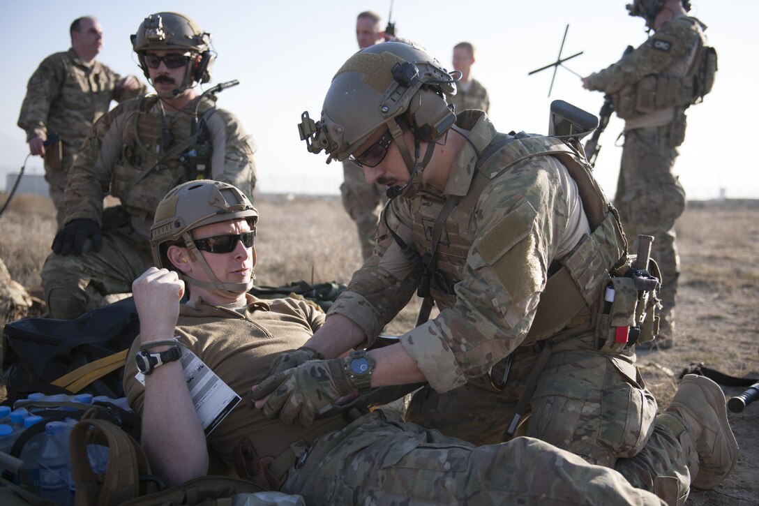 An Air Force pararescueman prepares a casualty to be airlifted during an extrication exercise on Bagram Airfield, Afghanistan, Jan. 23, 2016. The airman is assigned to the 83rd Expeditionary Rescue Squadron. The exercise allowed service members and the Craig Joint Theater Hospital to practice their response to real-world emergency scenarios. Air Force photo by Tech. Sgt. Robert Cloys 