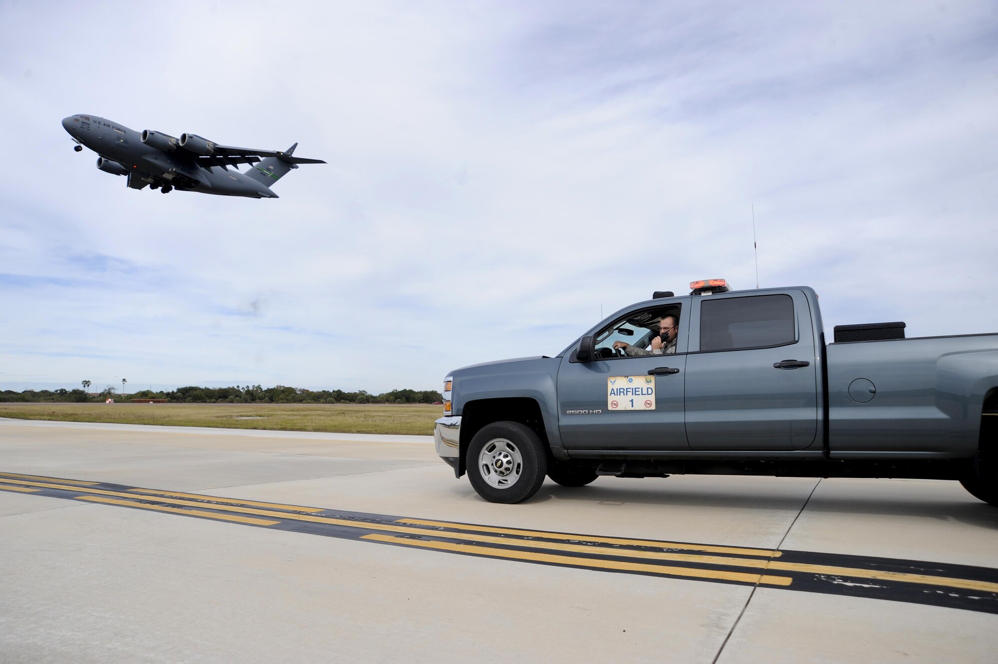 Staff Sgt. Michael David, an airfield management operations supervisor with the 6th Operations Support Squadron, waits for the air traffic control tower to clear him onto the airfield at MacDill Air Force Base, Fla., Jan. 22, 2016. Airfield management Airmen are responsible for performing multiple daily airfield checks to ensure it’s safe for aircraft. (U.S. Air Force photo/Airman 1st Class Mariette M. Adams)