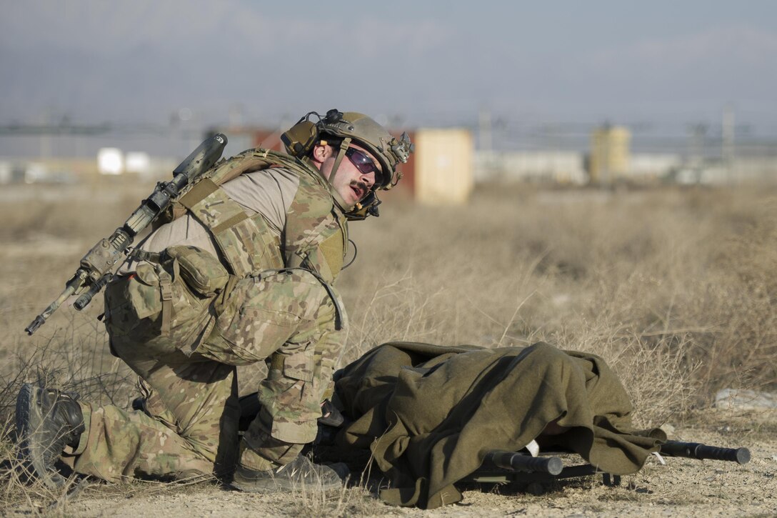 An Air Force pararescueman prepares a casualty for air evacuation during an extrication exercise on Bagram Airfield, Afghanistan, Jan. 23, 2016. Air Force photo by Tech. Sgt. Robert Cloys  