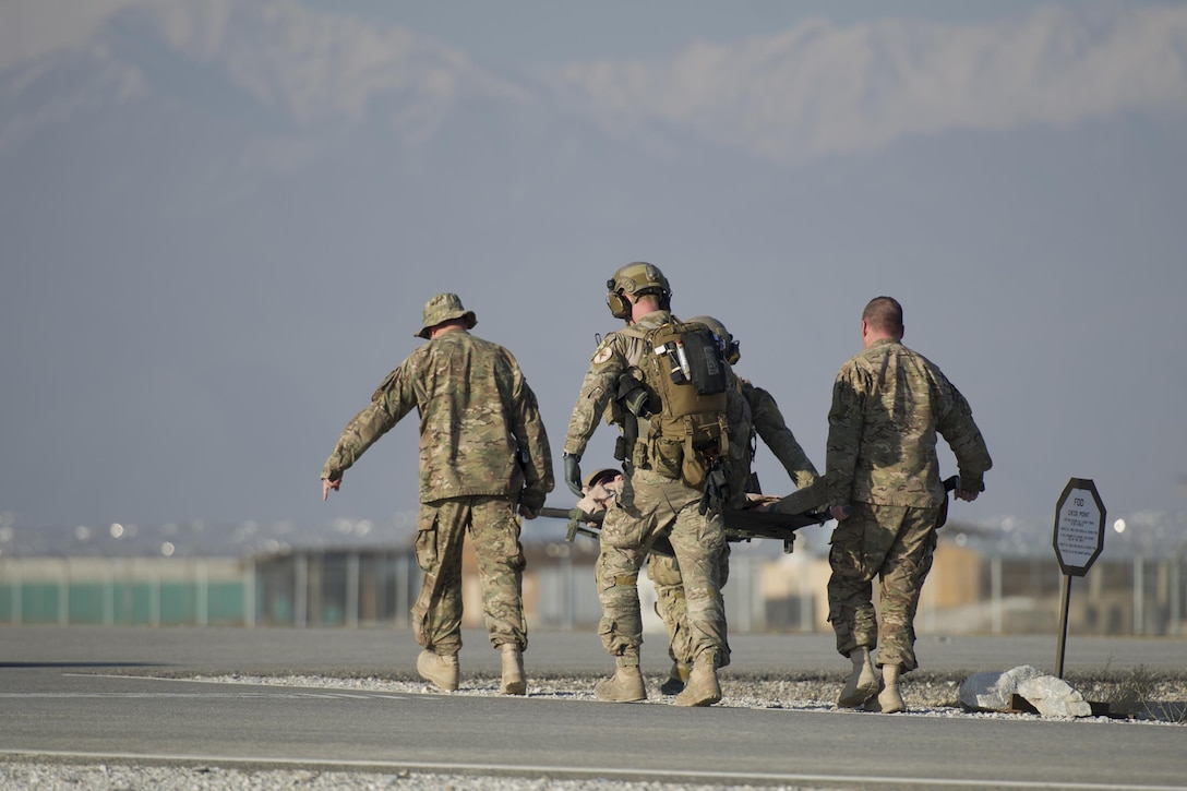 Air Force pararescuemen carry a casualty to an evacuation point during an extrication exercise on Bagram Airfield, Afghanistan, Jan. 23, 2016. Air Force photo by Tech. Sgt. Robert Cloys