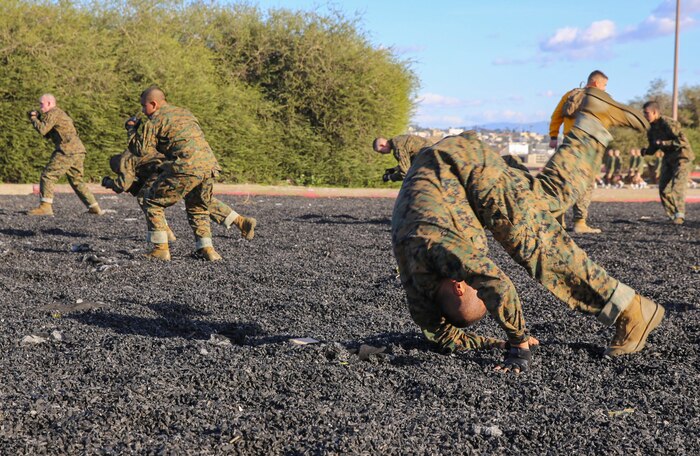 A recruit of Hotel Company, 2nd Recruit Training Battalion, executes a forward shoulder roll during a Marine Corps Martial Arts Program session at Marine Corps Recruit Depot San Diego, Feb. 2. Recruits learned the moves step-by-step before trying the techniques on their partners. One of the purposes of MCMAP is to teach recruits how to defeat the enemy using hand-to-hand combat. Annually, more than 17,000 males recruited from the Western Recruiting Region are trained at MCRD San Diego. Hotel Company is scheduled to graduate April 8.