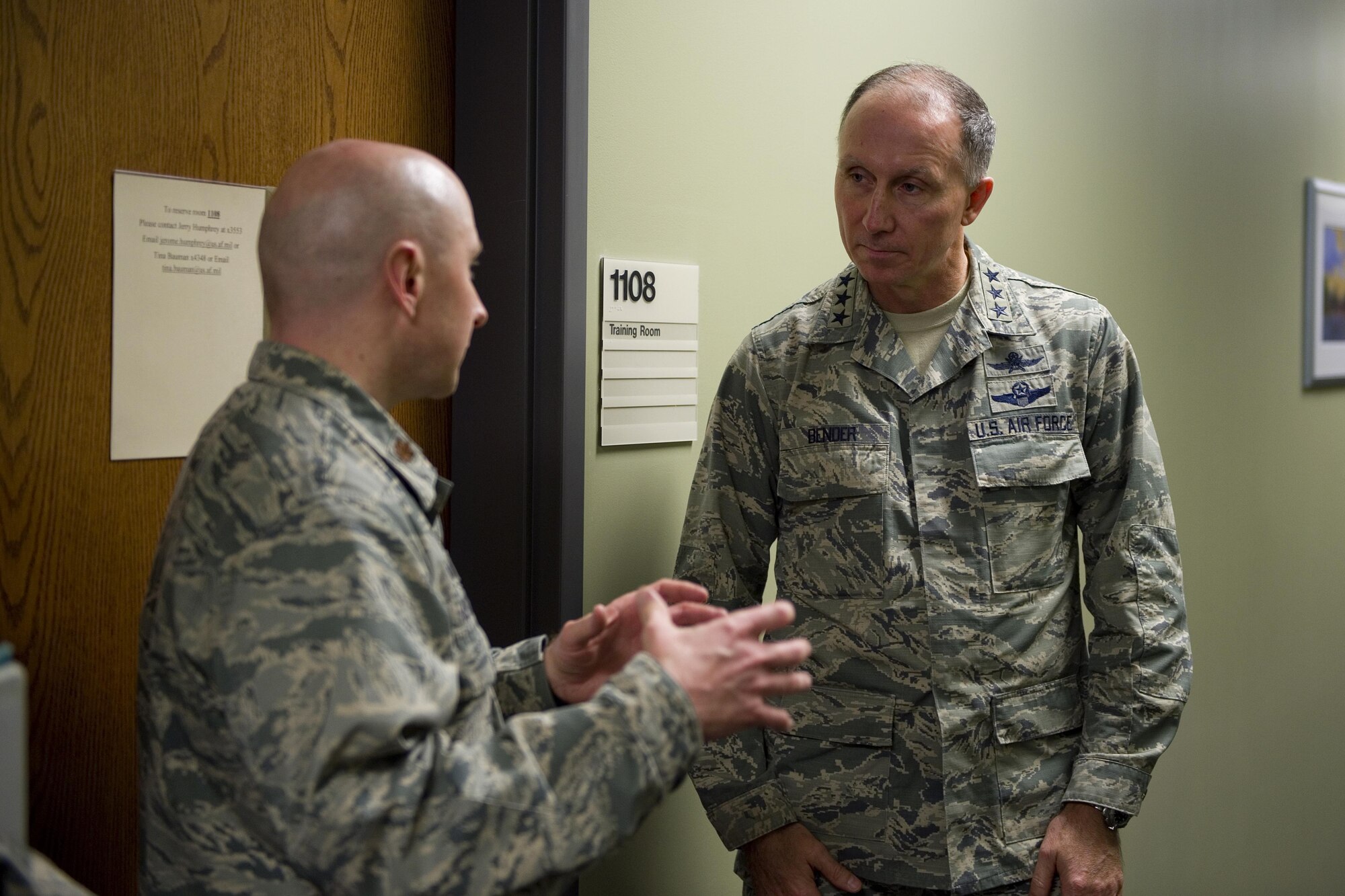 Maj. Denney Neace, 434th Communications Squadron commander, speaks to Lt. Gen. Bill Bender, Air Force chief of information dominance and chief information officer, about their mission and capabilities during a visit at Grissom Air Reserve Base, Ind., Jan. 14, 2016. The 434th ARW was recently selected as one of two lead pilot squadrons in the Air Force Reserve Command to transition into a next generation communications squadron. (U.S. Air Force photo/Tech. Sgt. Benjamin Mota)