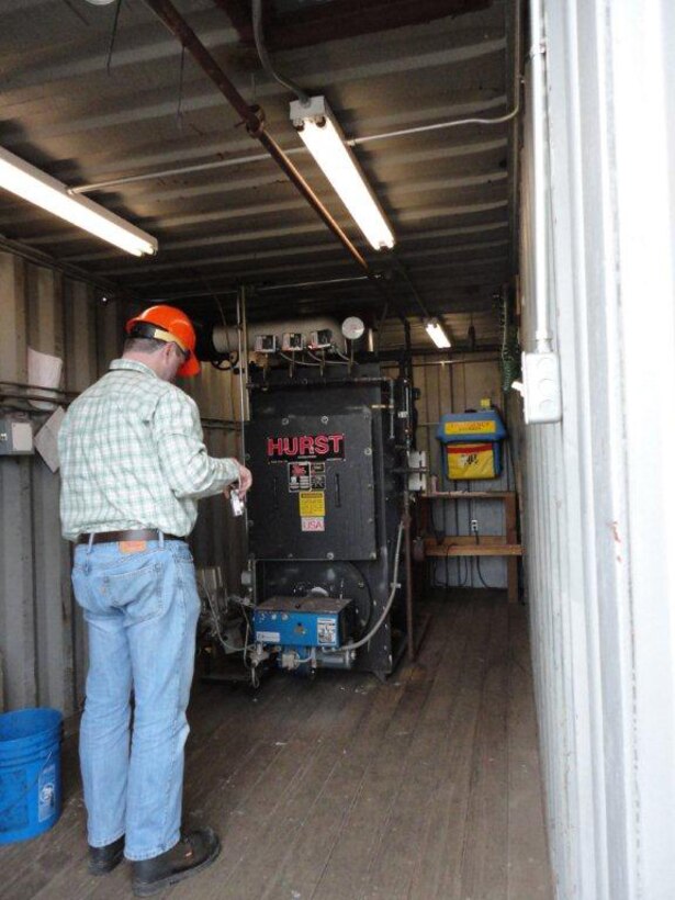 An EEAP auditor performs an evaluation of a steam boiler at Portland Moorings.The evaluation provides the planning needed to identify federally mandated energy reduction opportunities and propose energy related projects in order to meet the energy and water intensity reduction requirements. 