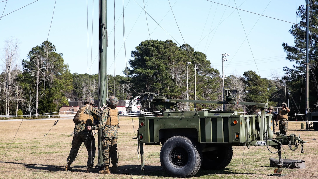 Marines with Headquarters Company, Combat Logistics Regiment 25, conduct a maintenance check on an antenna during a command post exercise at Camp Lejeune, N.C., Feb. 2, 2016. The CPX was held as a pre-cursor to an II Marine Expeditionary Force-wide CPX. 