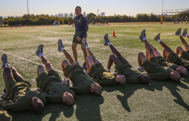 Recruits of Mike Company, 3rd Recruit Training Battalion, conduct hip raises during the bases event at Marine Corps Recruit Depot San Diego, Feb. 2. The first part of the event lasted for an hour before the recruits and drill instructors tackled the circuit course. Annually, more than 17,000 males recruited from the Western Recruiting Region are trained at MCRD San Diego. Mike Company is scheduled to graduate April 15.